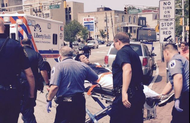 Photo of man being stretchered to ambulance following crash in Weehawken via Twitter user atlatlone.