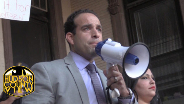 Carmelo Garcia hosting a rally before a Hoboken Housing Authority meeting where he was terminated from his post as executive director on August 4, 2014. 