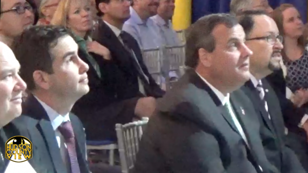 Jersey City Mayor Steven Fulop and Gov. Chris Christie sit next to each other during the Goya grand opening on April 29, 2015. 