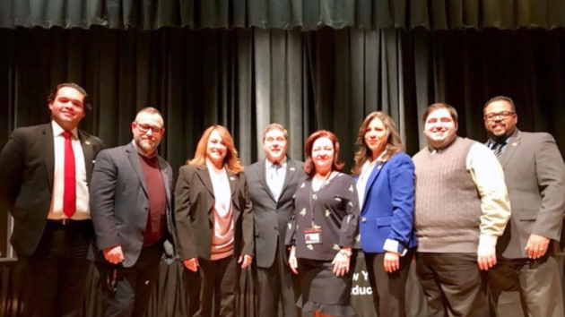 West New York Board of Education President Adam Parkinson (second from right) was elected to his third stint as the head of the board, with Trustee Damarys Gonzalez (next to Parkinson) also maintaining the vice presidency, on Wednesday. From left to right: Trustees Jonathan Castaneda, Jose Mendoza, Maite Fernandez, Mayor Felix Roque, Superintendent of Schools Clara Brito Herrera, Gonzalez, Parkinson and David Morel. Facebook photo. 